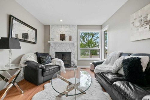 55 Macewan Drive Nw, Calgary, AB - Indoor Photo Showing Living Room With Fireplace