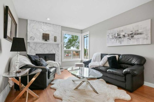 55 Macewan Drive Nw, Calgary, AB - Indoor Photo Showing Living Room With Fireplace