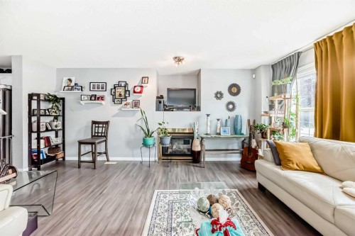 158 Bridleridge Circle Sw, Calgary, AB - Indoor Photo Showing Living Room With Fireplace