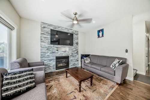 9 Saddlecrest Crescent Ne, Calgary, AB - Indoor Photo Showing Living Room With Fireplace