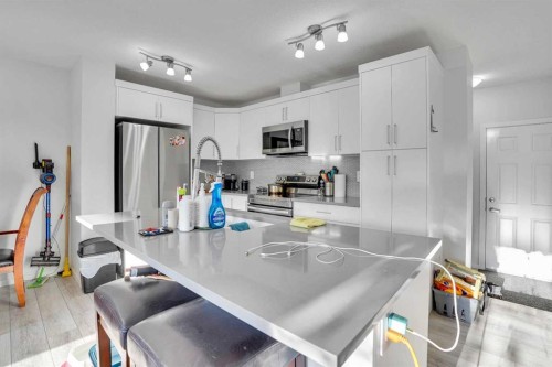 216 Windbury Lane Sw, Airdrie, AB - Indoor Photo Showing Kitchen With Stainless Steel Kitchen With Upgraded Kitchen