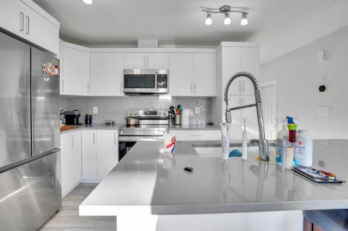 216 Windbury Lane Sw, Airdrie, AB - Indoor Photo Showing Kitchen With Stainless Steel Kitchen With Upgraded Kitchen