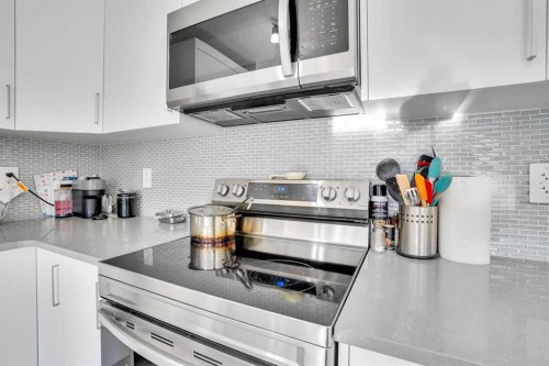 216 Windbury Lane Sw, Airdrie, AB - Indoor Photo Showing Kitchen With Stainless Steel Kitchen With Upgraded Kitchen