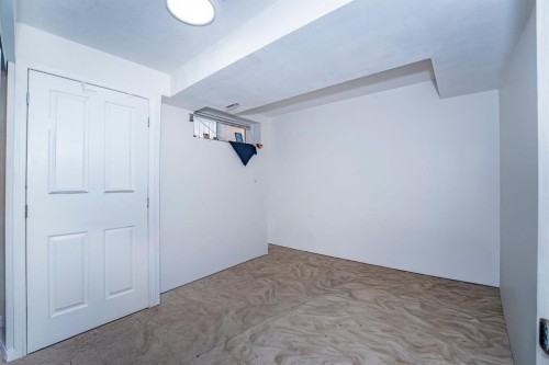 714 Martindale Boulevard Ne, Calgary, AB - Indoor Photo Showing Other Room