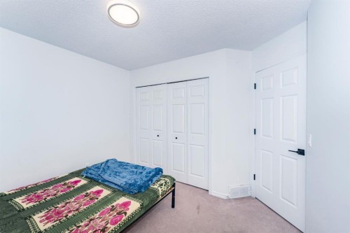 714 Martindale Boulevard Ne, Calgary, AB - Indoor Photo Showing Bedroom