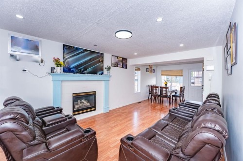 714 Martindale Boulevard Ne, Calgary, AB - Indoor Photo Showing Living Room With Fireplace