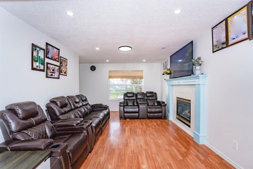 714 Martindale Boulevard Ne, Calgary, AB - Indoor Photo Showing Living Room With Fireplace