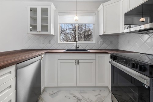 2205-7451 Springbank Boulevard Sw, Calgary, AB - Indoor Photo Showing Kitchen