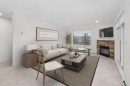 2205-7451 Springbank Boulevard Sw, Calgary, AB  - Indoor Photo Showing Living Room With Fireplace 