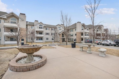 2205-7451 Springbank Boulevard Sw, Calgary, AB - Outdoor With Balcony With Facade