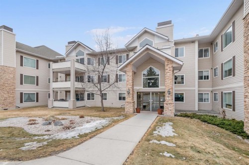 2205-7451 Springbank Boulevard Sw, Calgary, AB - Outdoor With Balcony With Facade