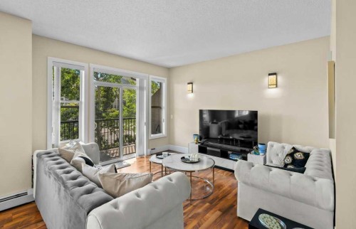 2206-211 Aspen Stone Boulevard Sw, Calgary, AB - Indoor Photo Showing Living Room