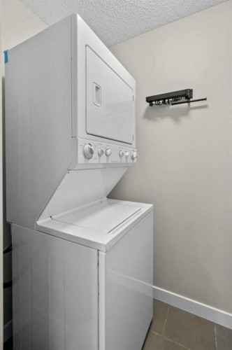 2206-211 Aspen Stone Boulevard Sw, Calgary, AB - Indoor Photo Showing Laundry Room