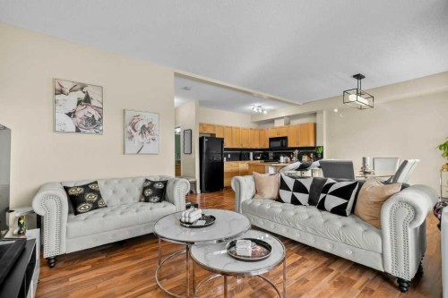 2206-211 Aspen Stone Boulevard Sw, Calgary, AB - Indoor Photo Showing Living Room