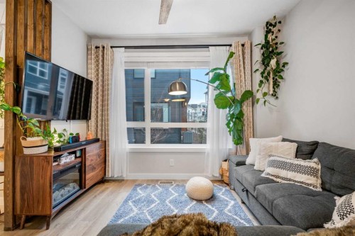716 Redstone Crescent Ne, Calgary, AB - Indoor Photo Showing Living Room With Fireplace