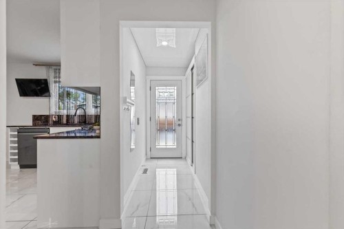 343 Queen Tamara Way Se, Calgary, AB - Indoor Photo Showing Other Room