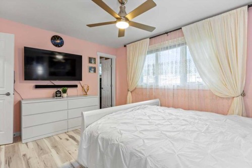 343 Queen Tamara Way Se, Calgary, AB - Indoor Photo Showing Bedroom