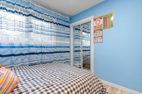 343 Queen Tamara Way Se, Calgary, AB - Indoor Photo Showing Bedroom