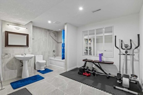 343 Queen Tamara Way Se, Calgary, AB - Indoor Photo Showing Gym Room