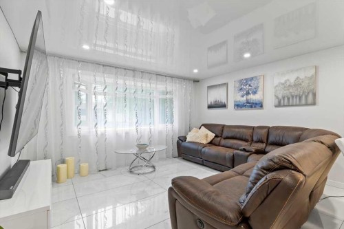 343 Queen Tamara Way Se, Calgary, AB - Indoor Photo Showing Living Room