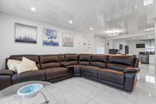 343 Queen Tamara Way Se, Calgary, AB - Indoor Photo Showing Living Room