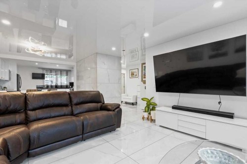 343 Queen Tamara Way Se, Calgary, AB - Indoor Photo Showing Living Room