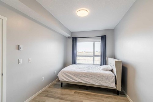 203-360 Harvest Hills Way Ne, Calgary, AB - Indoor Photo Showing Bedroom
