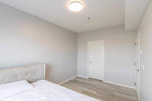 203-360 Harvest Hills Way Ne, Calgary, AB - Indoor Photo Showing Bedroom