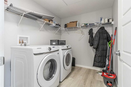 203-360 Harvest Hills Way Ne, Calgary, AB - Indoor Photo Showing Laundry Room