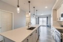 203-360 Harvest Hills Way Ne, Calgary, AB  - Indoor Photo Showing Kitchen With Upgraded Kitchen 