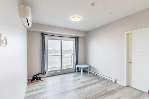 203-360 Harvest Hills Way Ne, Calgary, AB - Indoor Photo Showing Other Room