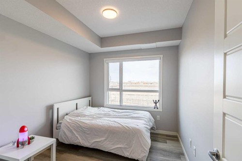 203-360 Harvest Hills Way Ne, Calgary, AB - Indoor Photo Showing Bedroom