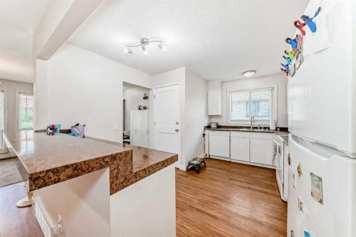 6327 24 Avenue Ne, Calgary, AB - Indoor Photo Showing Kitchen With Double Sink