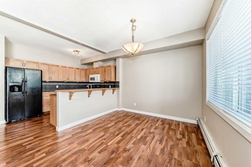 2210-211 Aspen Stone Boulevard Sw, Calgary, AB - Indoor Photo Showing Kitchen