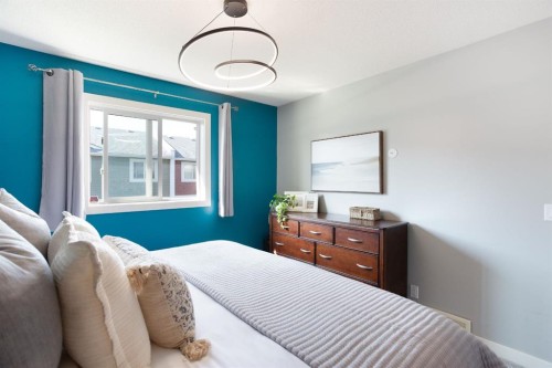 1405-800 Yankee Valley Boulevard Se, Airdrie, AB - Indoor Photo Showing Bedroom