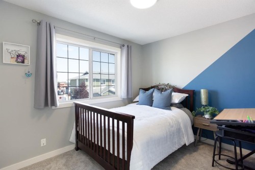 1405-800 Yankee Valley Boulevard Se, Airdrie, AB - Indoor Photo Showing Bedroom