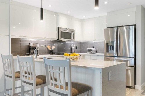 227-15 Aspenmont Heights Sw, Calgary, AB - Indoor Photo Showing Kitchen With Stainless Steel Kitchen With Upgraded Kitchen
