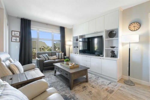 227-15 Aspenmont Heights Sw, Calgary, AB - Indoor Photo Showing Living Room