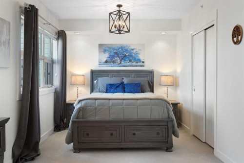 227-15 Aspenmont Heights Sw, Calgary, AB - Indoor Photo Showing Bedroom