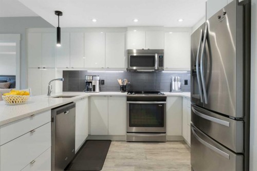 227-15 Aspenmont Heights Sw, Calgary, AB - Indoor Photo Showing Kitchen With Stainless Steel Kitchen With Upgraded Kitchen