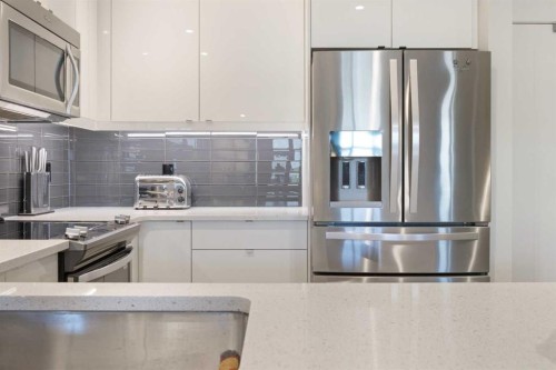 227-15 Aspenmont Heights Sw, Calgary, AB - Indoor Photo Showing Kitchen With Stainless Steel Kitchen With Upgraded Kitchen