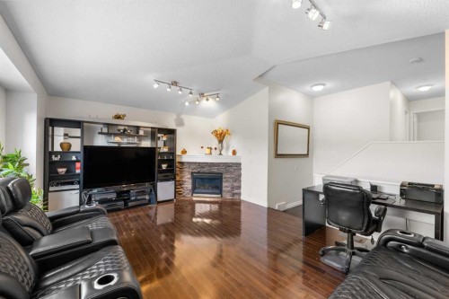 113 Citadel Ridge Green Nw, Calgary, AB - Indoor Photo Showing Living Room With Fireplace
