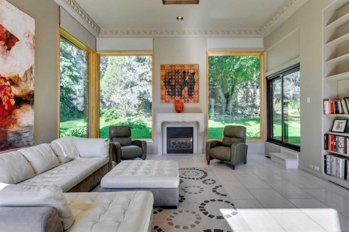 40 Eagle Ridge Place Sw, Calgary, AB - Indoor Photo Showing Living Room With Fireplace