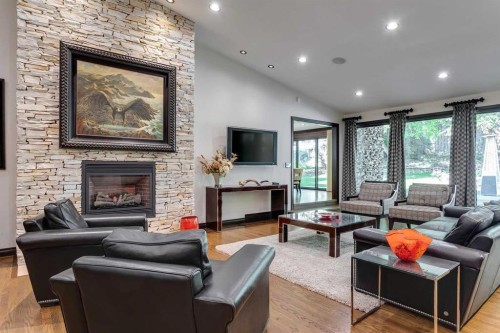 40 Eagle Ridge Place Sw, Calgary, AB - Indoor Photo Showing Living Room With Fireplace