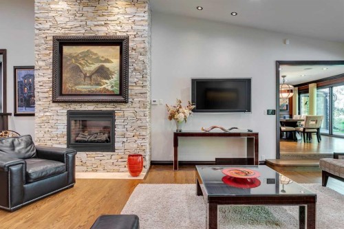 40 Eagle Ridge Place Sw, Calgary, AB - Indoor Photo Showing Living Room With Fireplace