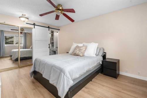 212 Woodbine Boulevard Sw, Calgary, AB - Indoor Photo Showing Bedroom