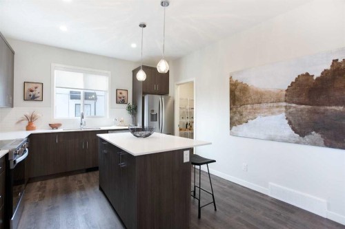 404-1750 Rangeview Drive Se, Calgary, AB - Indoor Photo Showing Kitchen With Stainless Steel Kitchen With Upgraded Kitchen