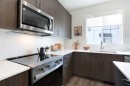 404-1750 Rangeview Drive Se, Calgary, AB  - Indoor Photo Showing Kitchen With Double Sink With Upgraded Kitchen 