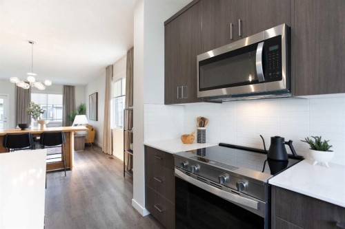 404-1750 Rangeview Drive Se, Calgary, AB - Indoor Photo Showing Kitchen With Upgraded Kitchen