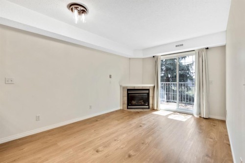 321-103 Strathaven Drive, Strathmore, AB - Indoor Photo Showing Living Room With Fireplace
